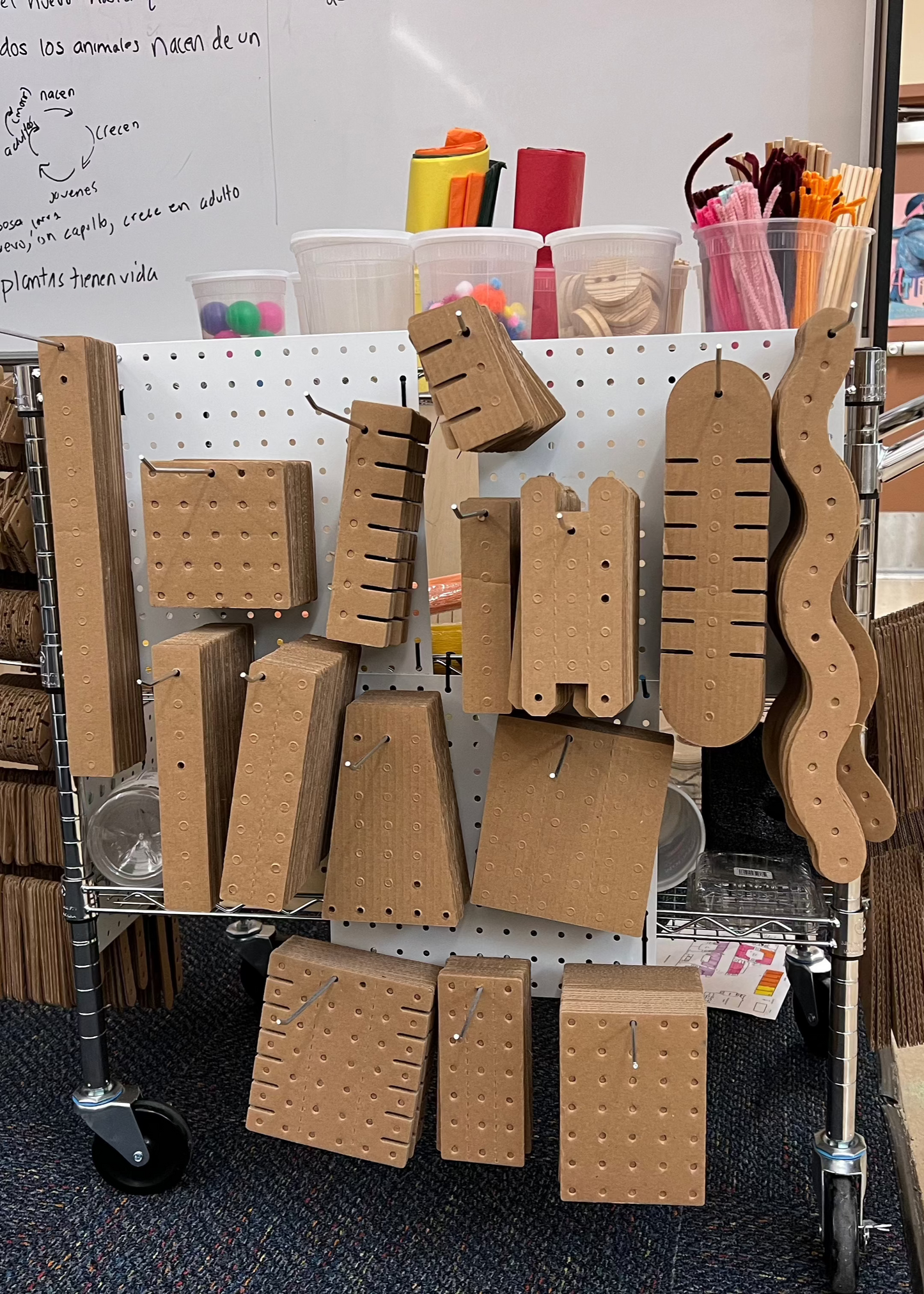 A cart with 7pegboards carrying KitCo products