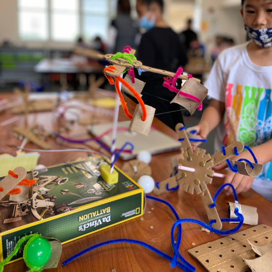 Kid elaborating a project during a Kitco Camp