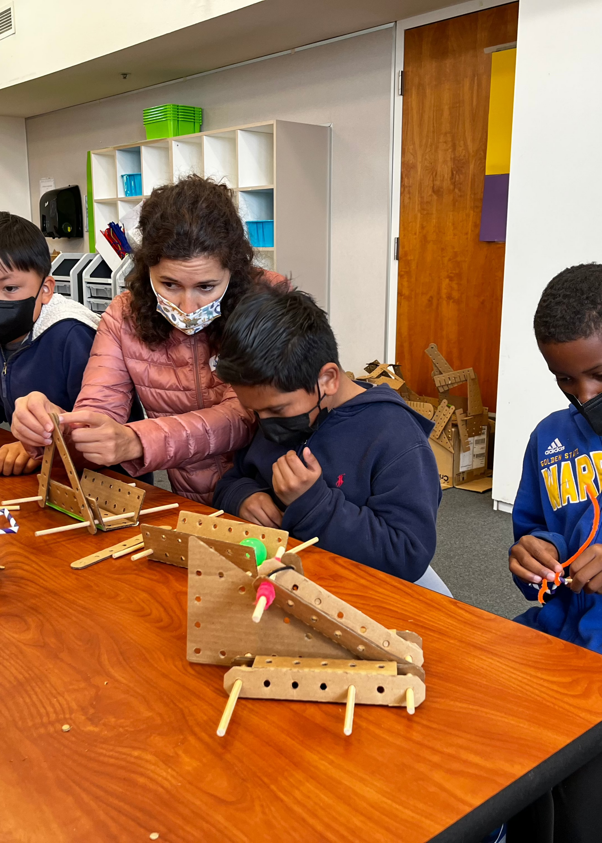 Kids performing a STEM project with Kitco Classroom kit