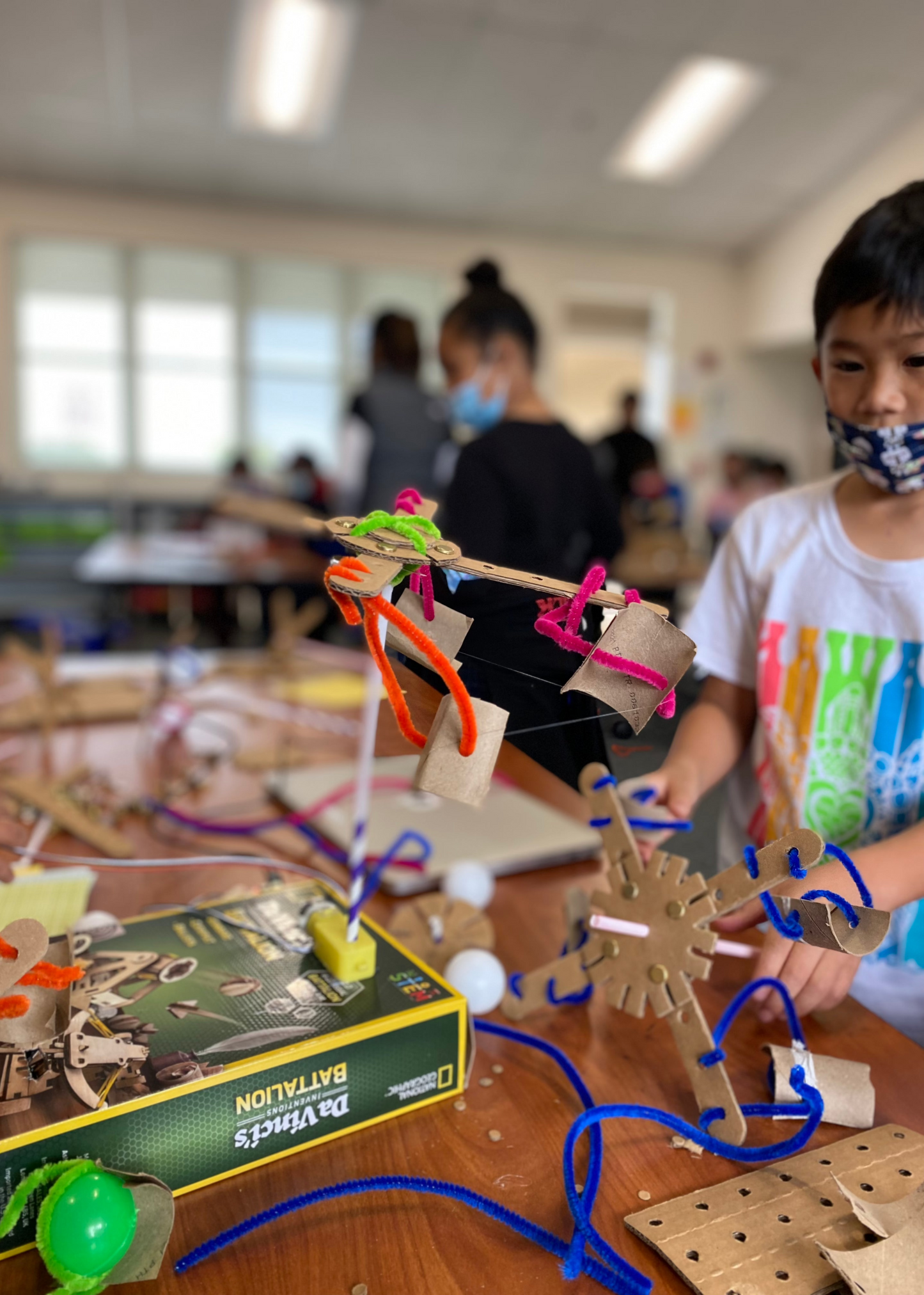 A kid creating a project with the Kitco School Kit