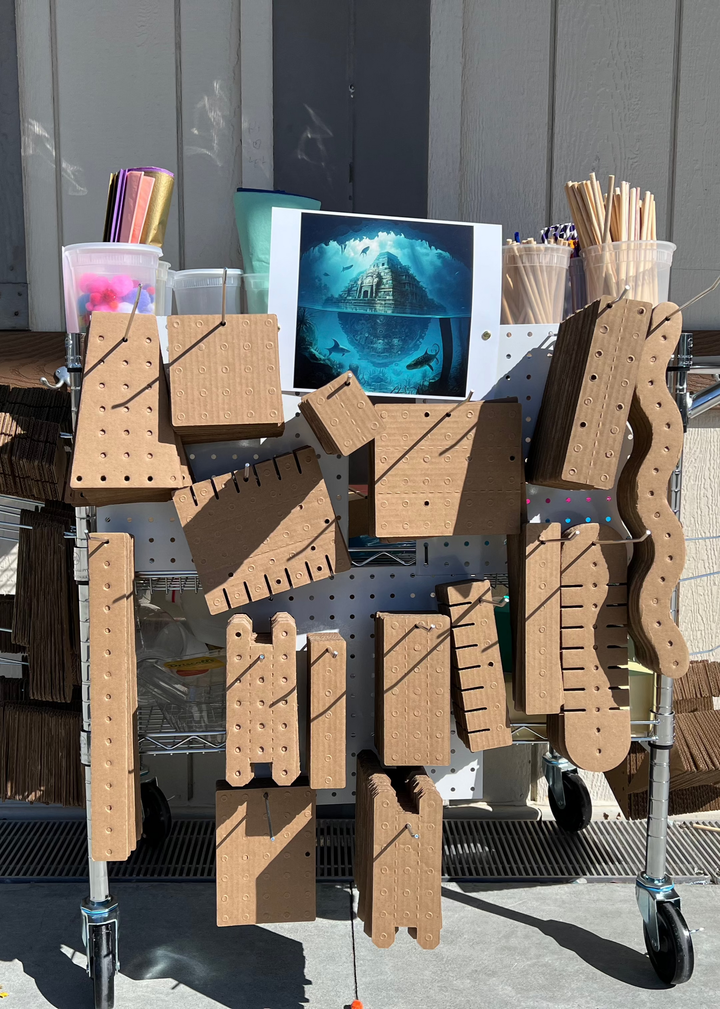 A cart with 7 pegboards carrying KitCo products