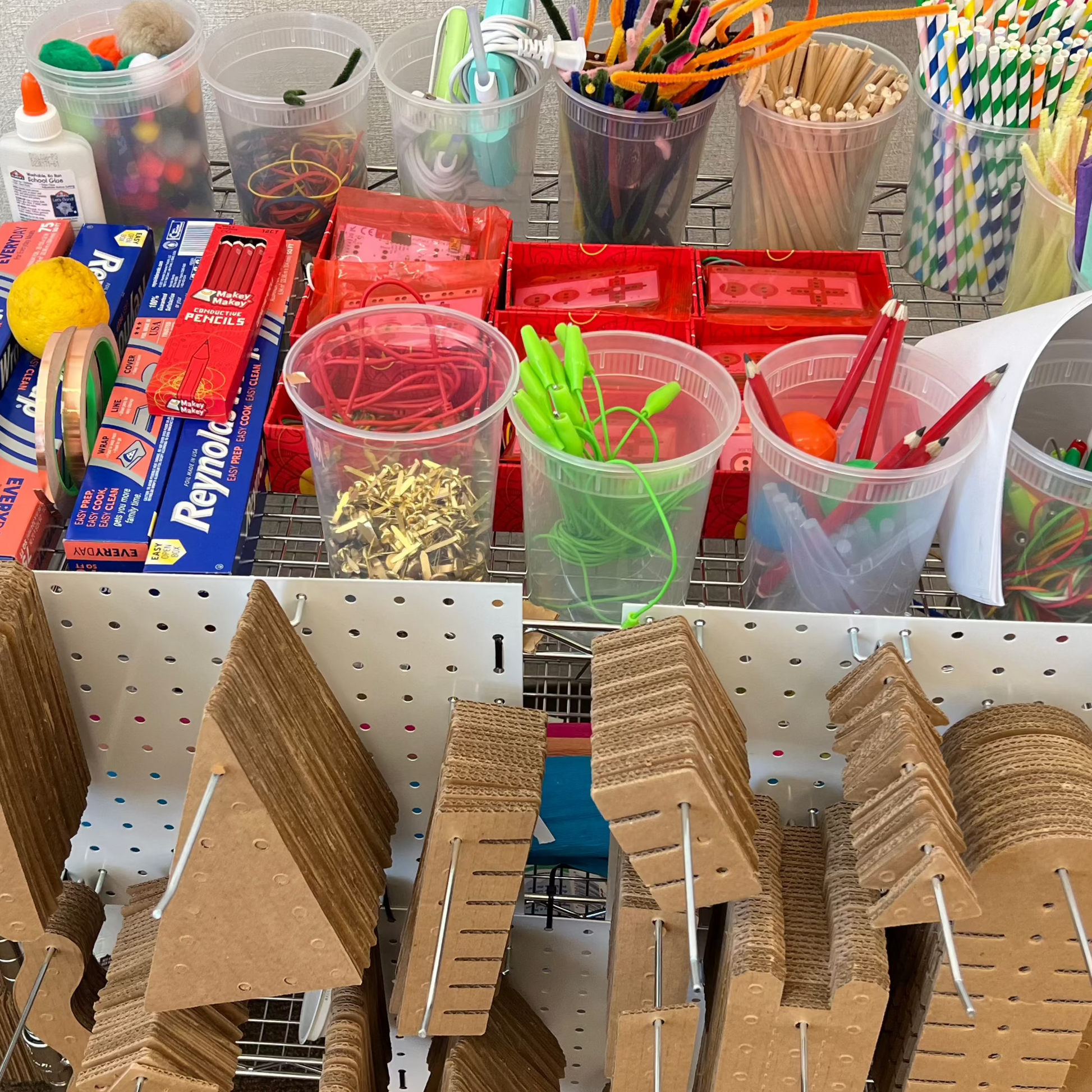 A cart with 7 pegboards carrying KitCo products